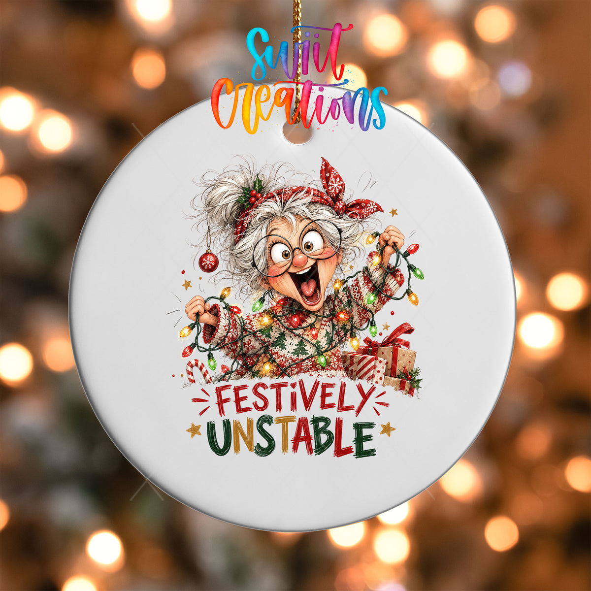 Close-up of the Festively Unstable UV DTF transfer on a round white ornament