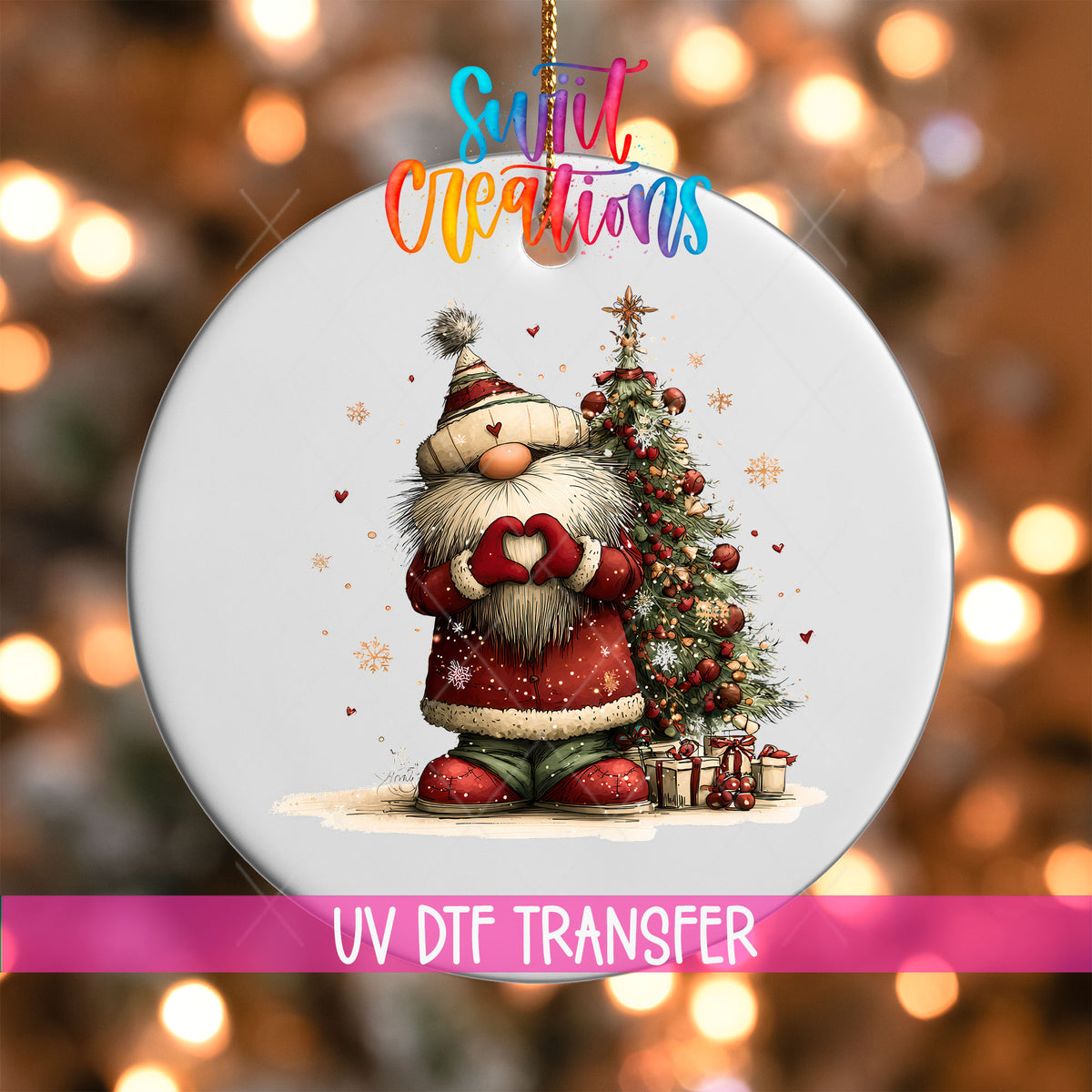 Cute Santa in a knit hat beside a Christmas tree UV DTF transfer on a white ornament with a pink UV DTF Transfer banner and bokeh lights