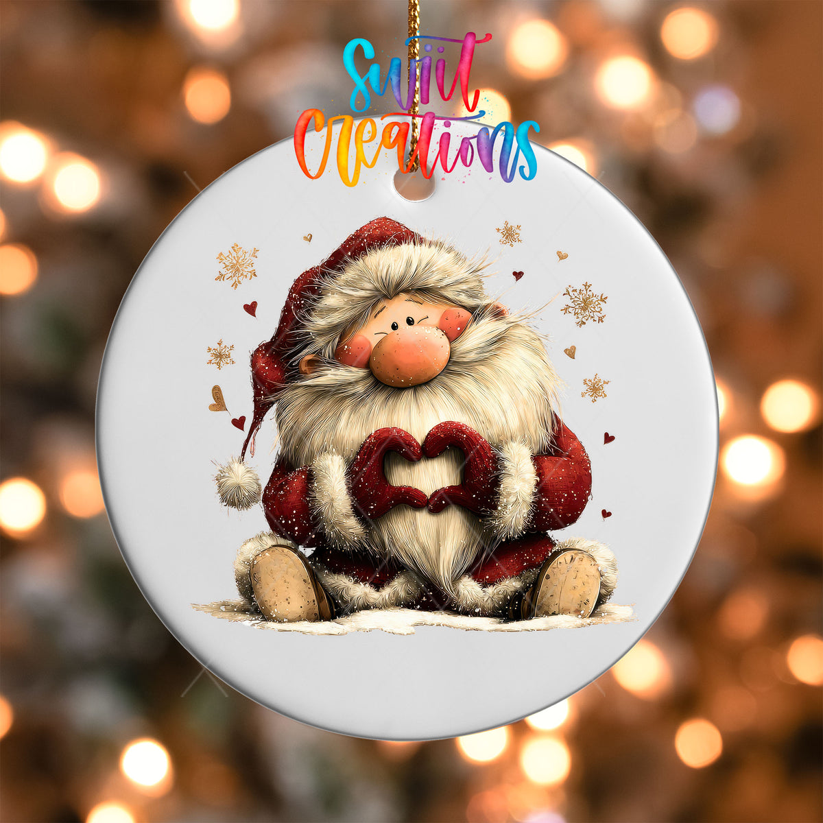 Close-up of the Cute sitting Santa making heart hands UV DTF transfer on a round white ornament