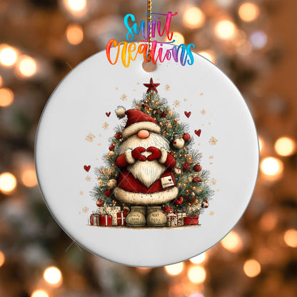 Close-up of the Cute Santa with a letter in front of a Christmas tree UV DTF transfer on a round white ornament