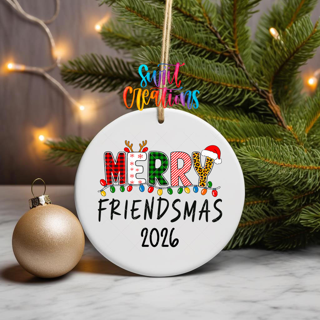 Merry Friendsmas 2026 ornament UV DTF transfer on a hanging ornament with pine branches and a gold bauble