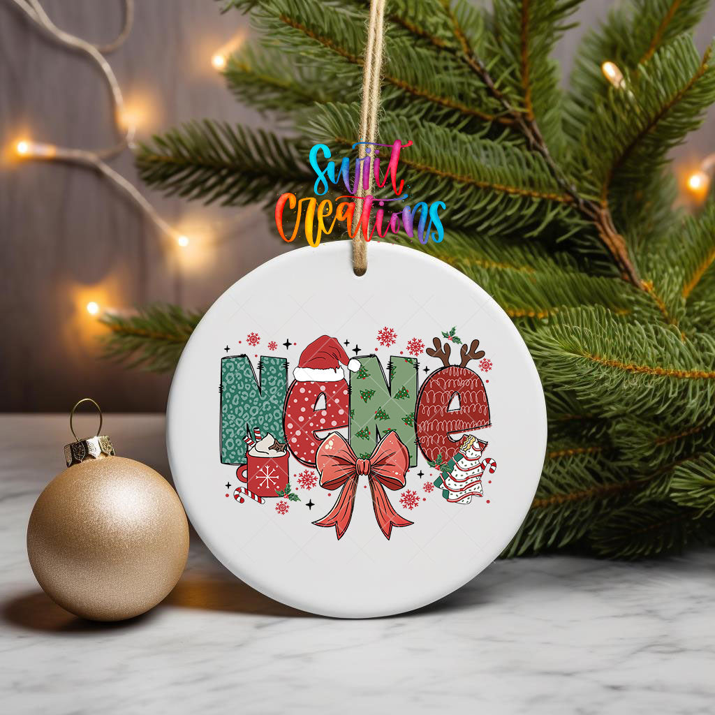Nene grandma name UV DTF transfer on an ornament hanging from pine branches beside a gold bauble