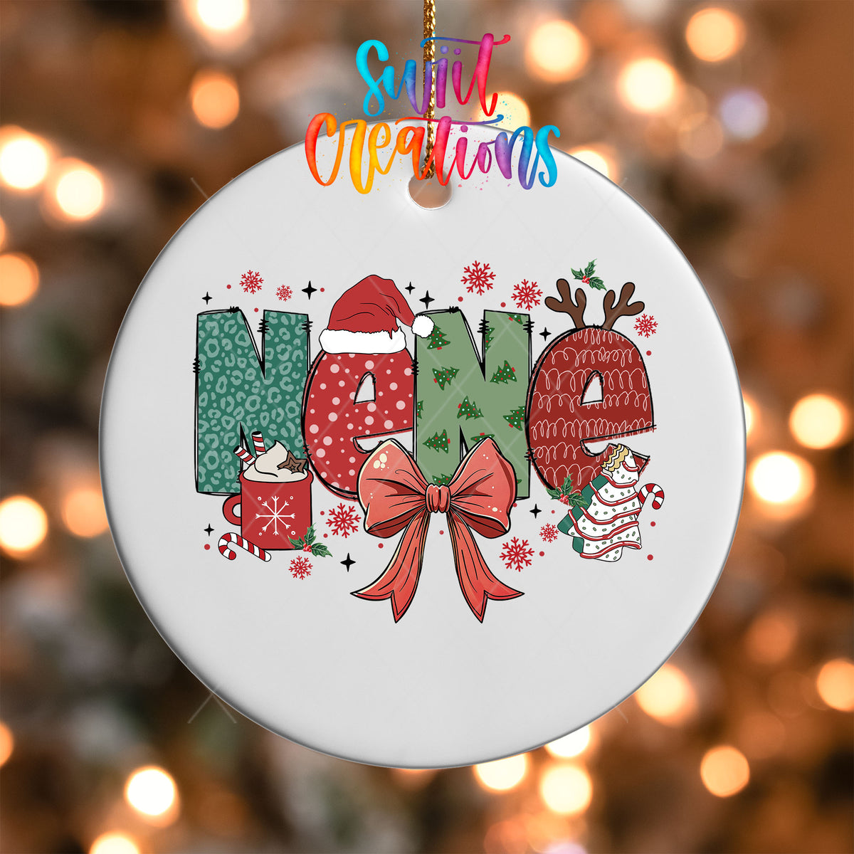 Close-up of the Nene grandma name UV DTF transfer with a Santa hat, antlers, and red coquette bow on a white ornament