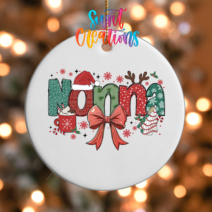 Close-up of the Nonna grandma name UV DTF transfer with a Santa hat, antlers, and red coquette bow on a white ornament