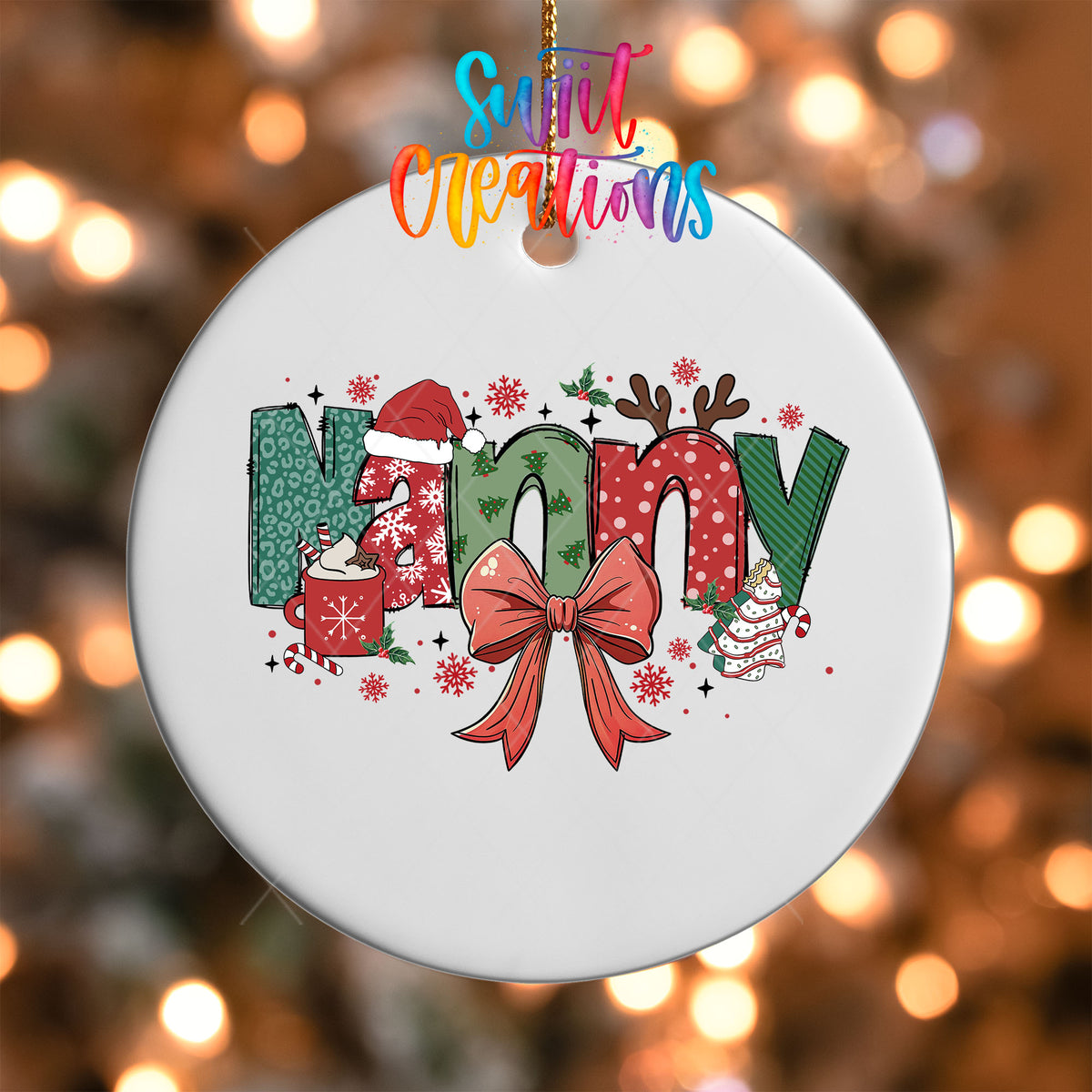 Close-up of the Nanny grandma name UV DTF transfer with a Santa hat, antlers, and red coquette bow on a white ornament