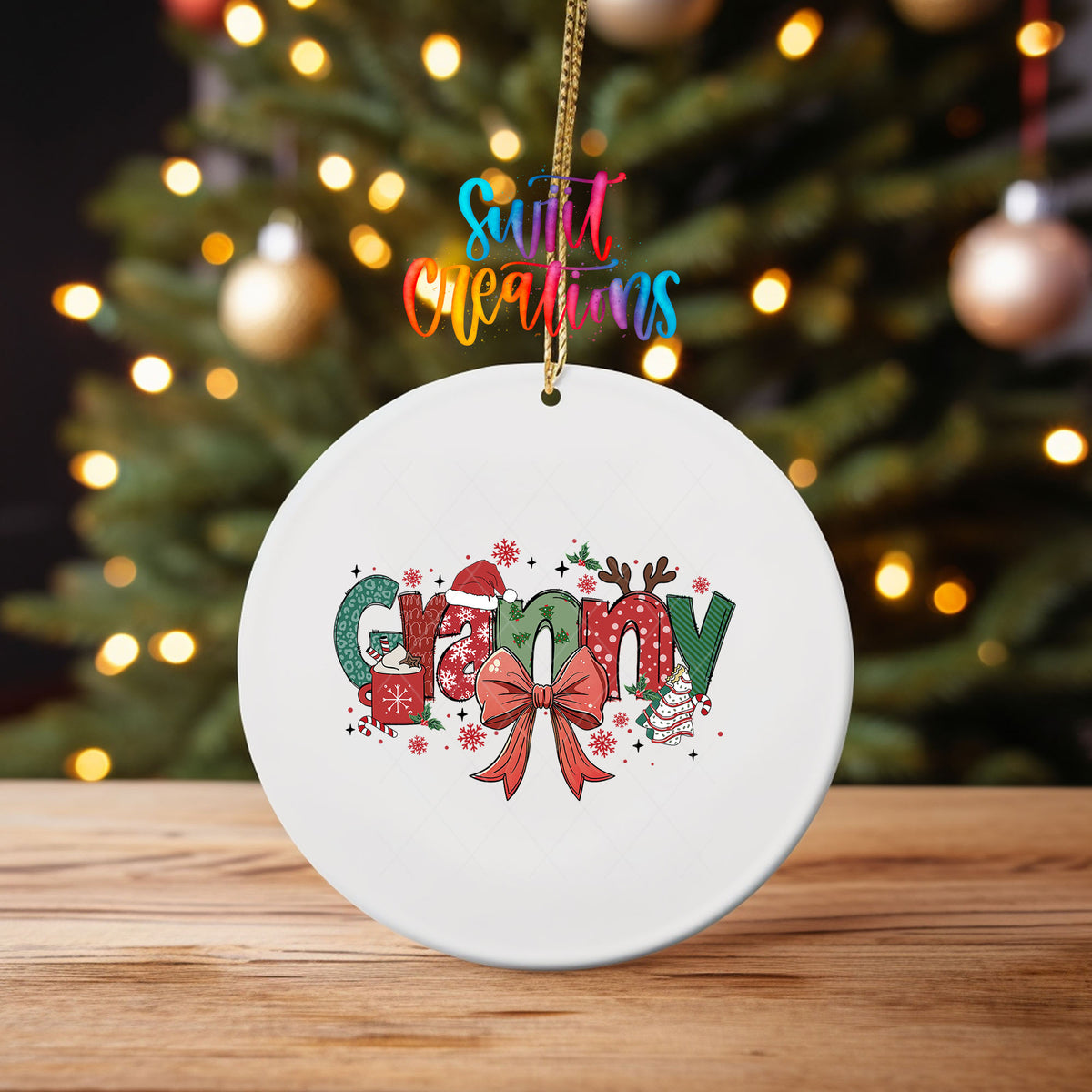 Granny grandma name UV DTF transfer on an ornament on a wooden table with Christmas tree lights