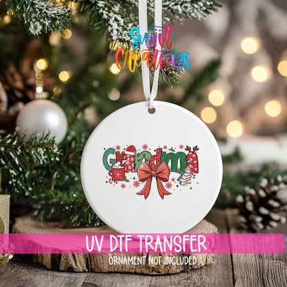 Grandma UV DTF transfer on a hanging ornament above a wood slice with pinecones and a UV DTF Transfer banner