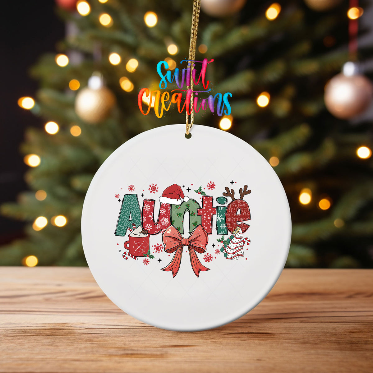 Auntie UV DTF transfer on an ornament on a wooden table with Christmas tree lights