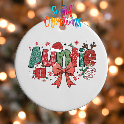 Close-up of the Auntie UV DTF transfer with a Santa hat, antlers, and red coquette bow on a white ornament