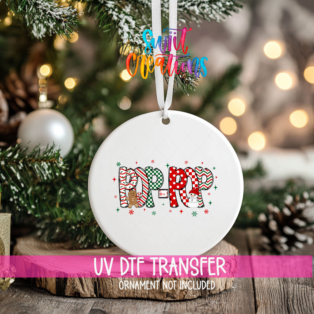 Pop-Pop grandpa name UV DTF transfer on a hanging ornament above a wood slice with pinecones and a UV DTF Transfer banner