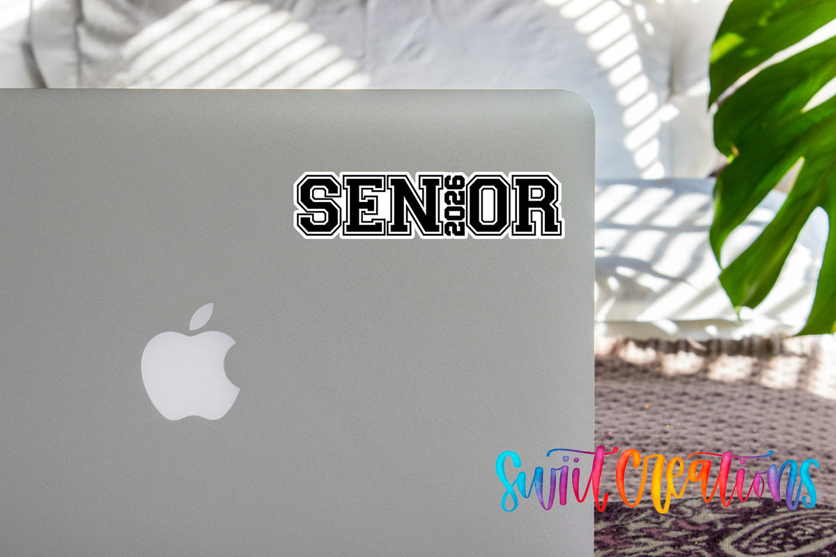 Senior 2026 graduation sticker on the lid of a silver laptop