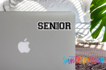 Senior 2026 graduation sticker on the lid of a silver laptop