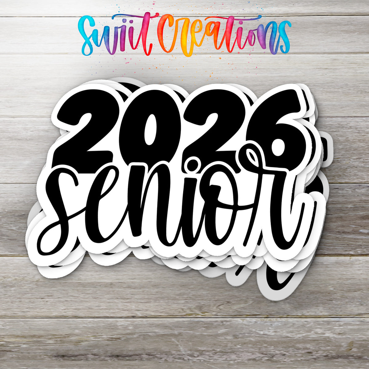 Stack of 2026 Senior glossy stickers on a gray wood table