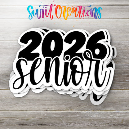 Stack of 2026 Senior glossy stickers on a gray wood table
