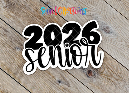 Close-up of the 2026 Senior sticker with senior in black script on rustic wood