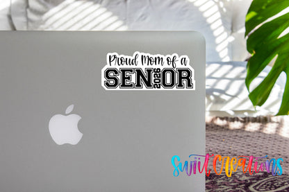 Proud Mom of a 2026 Senior sticker on the lid of a silver laptop
