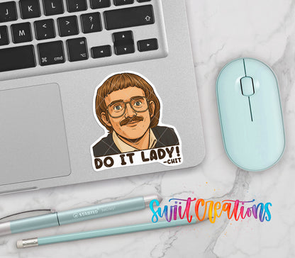 Do It Lady vinyl sticker on a silver laptop next to a mint mouse and pens