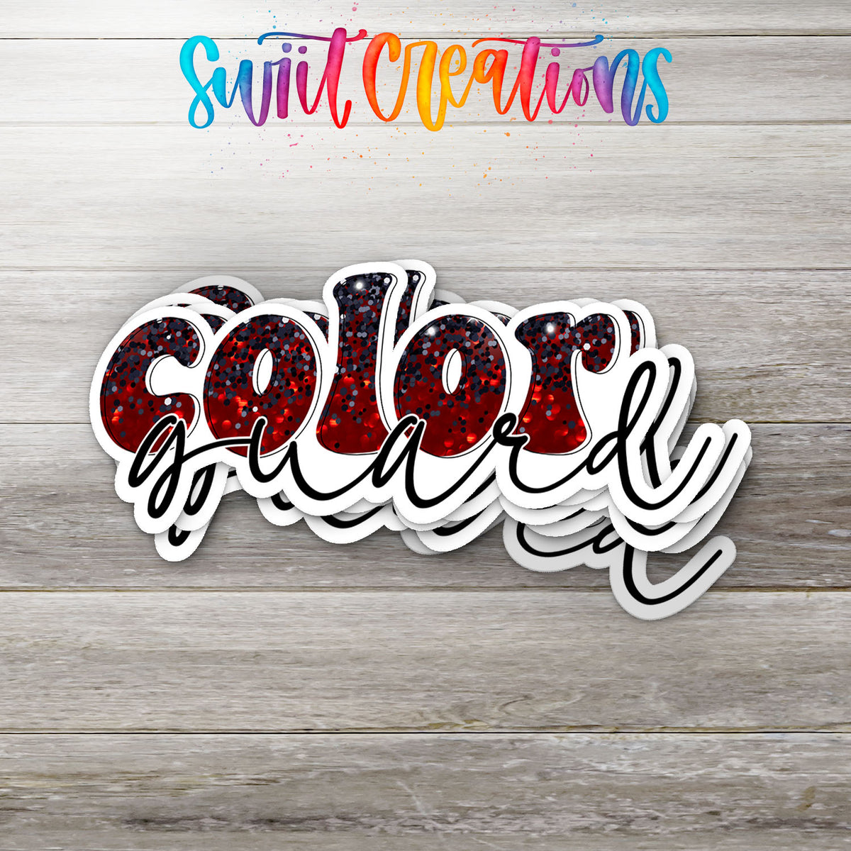 Stack of red and black Color Guard glossy stickers on a gray wood table