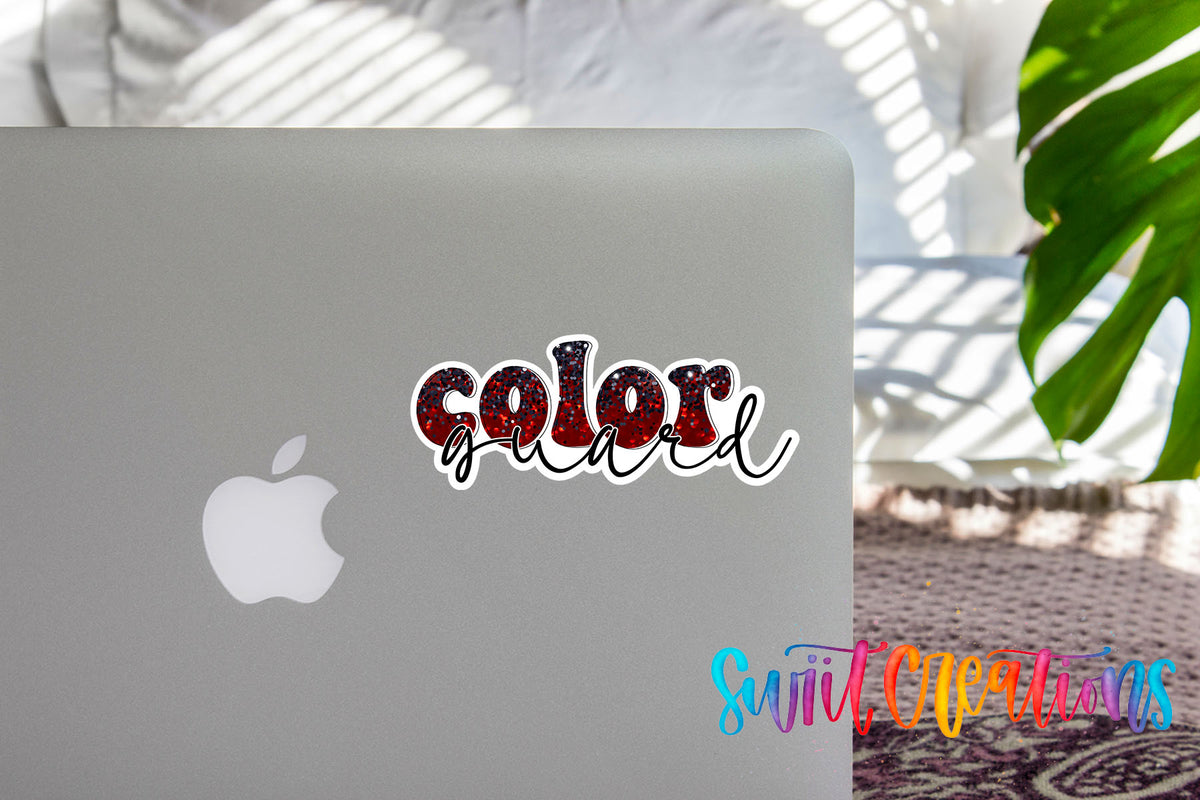Red and black Color Guard sticker on the lid of a silver laptop