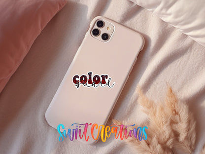 Red and black Color Guard sticker on a pink phone case resting on a bed