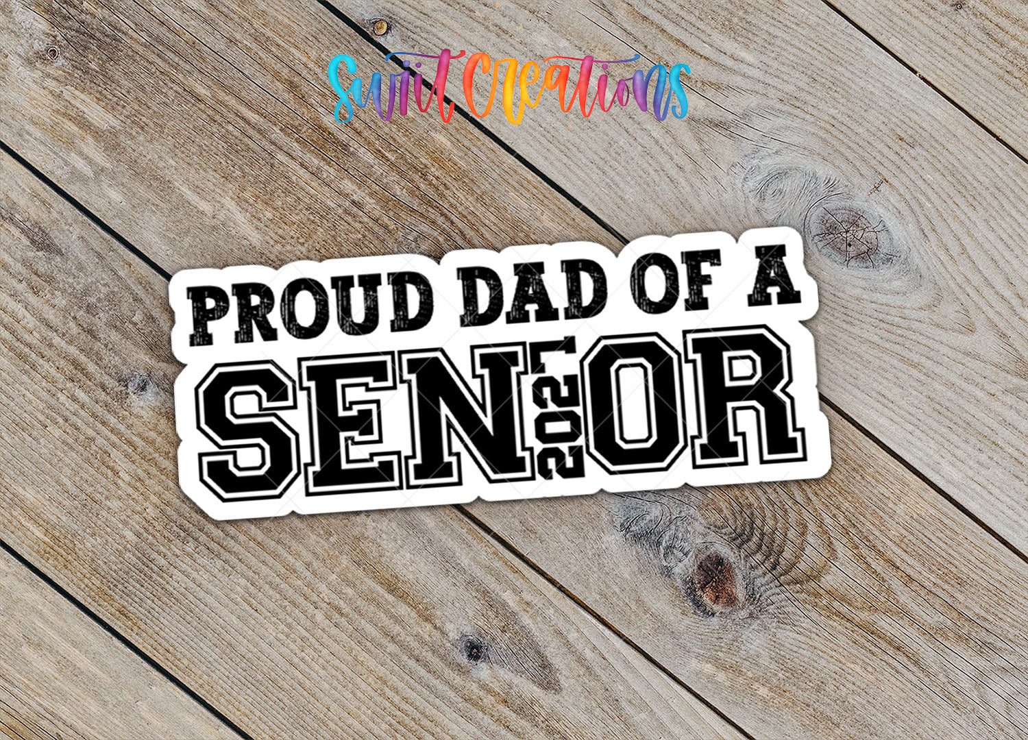 Proud Dad of a Senior 2027 waterproof vinyl sticker on a wood background