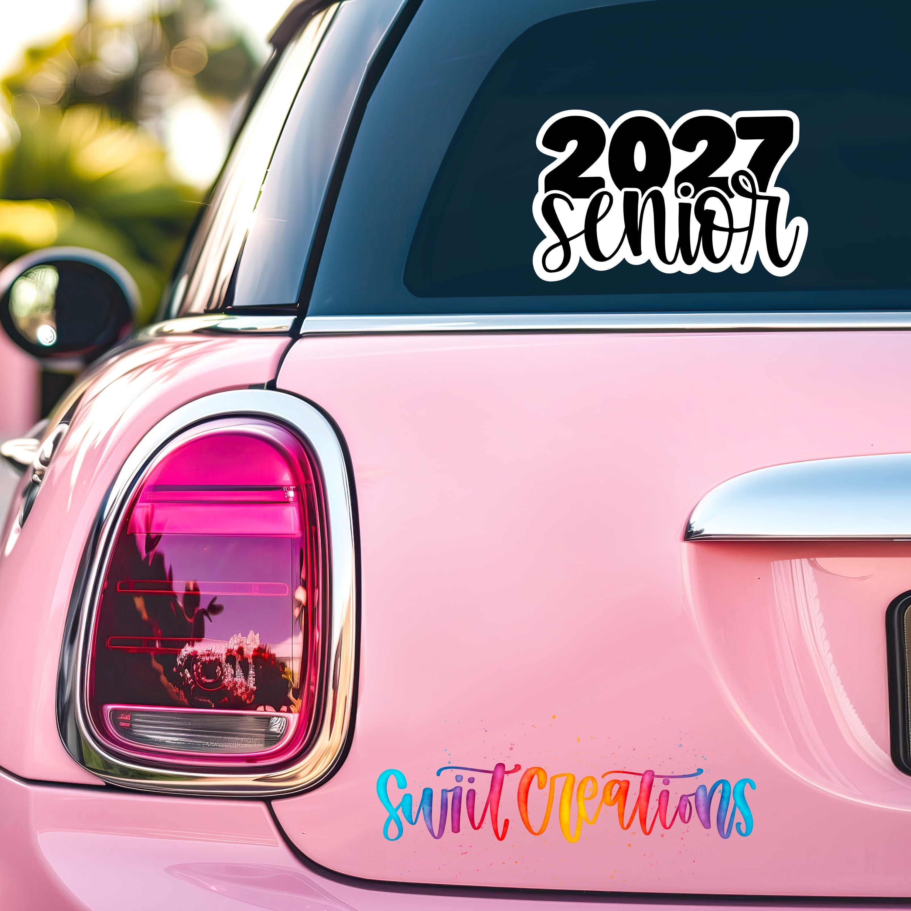 2027 Senior waterproof vinyl sticker displayed on a car window