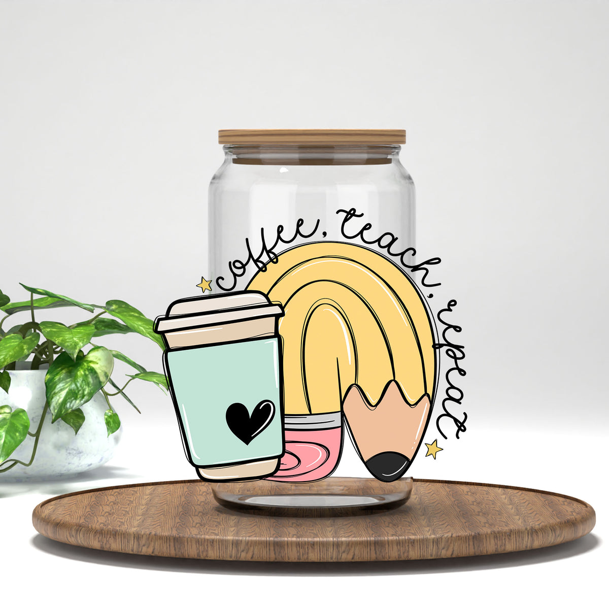 Coffee Teach Repeat UV DTF transfer on a clear glass can