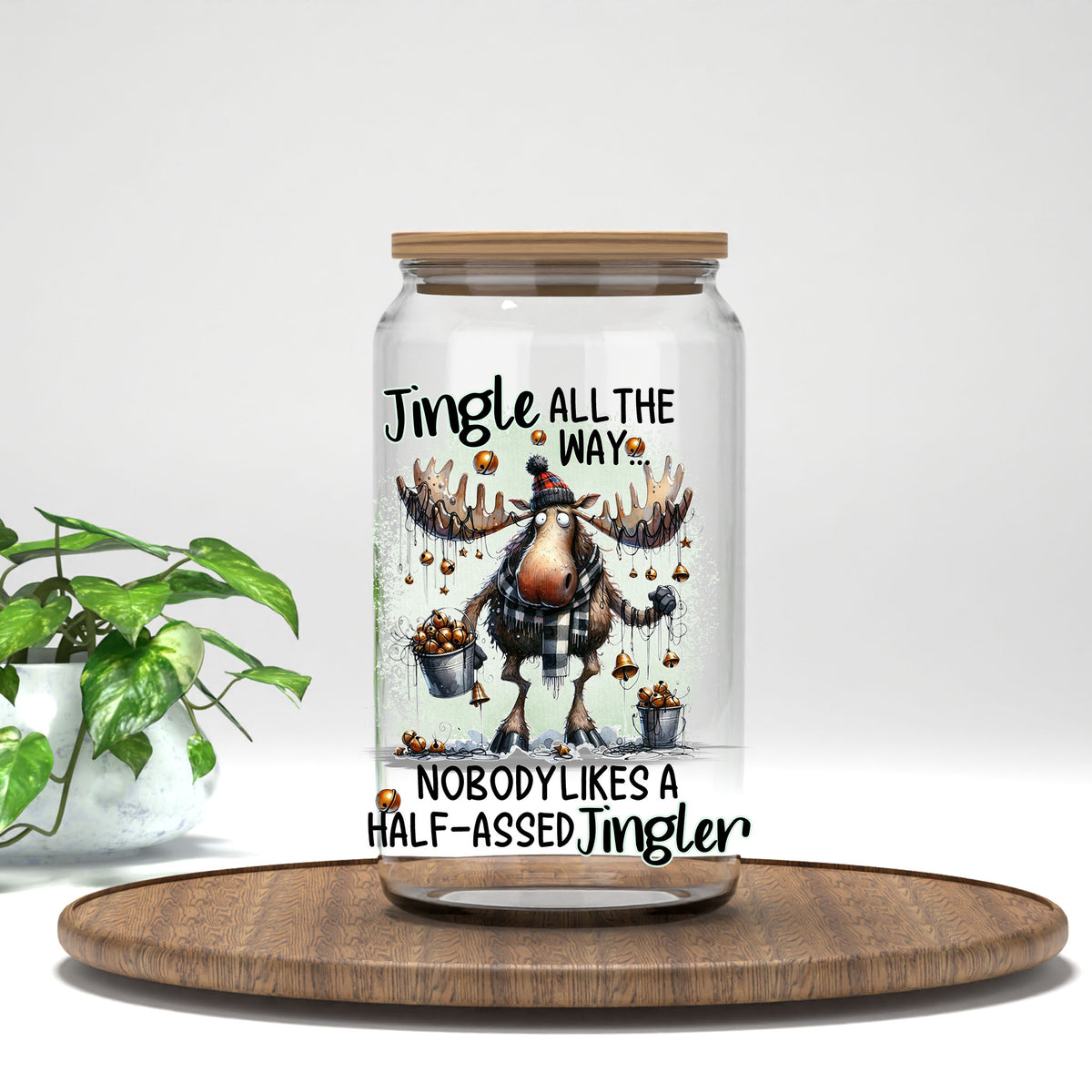 Jingle All the Way UV DTF transfer on a clear glass can