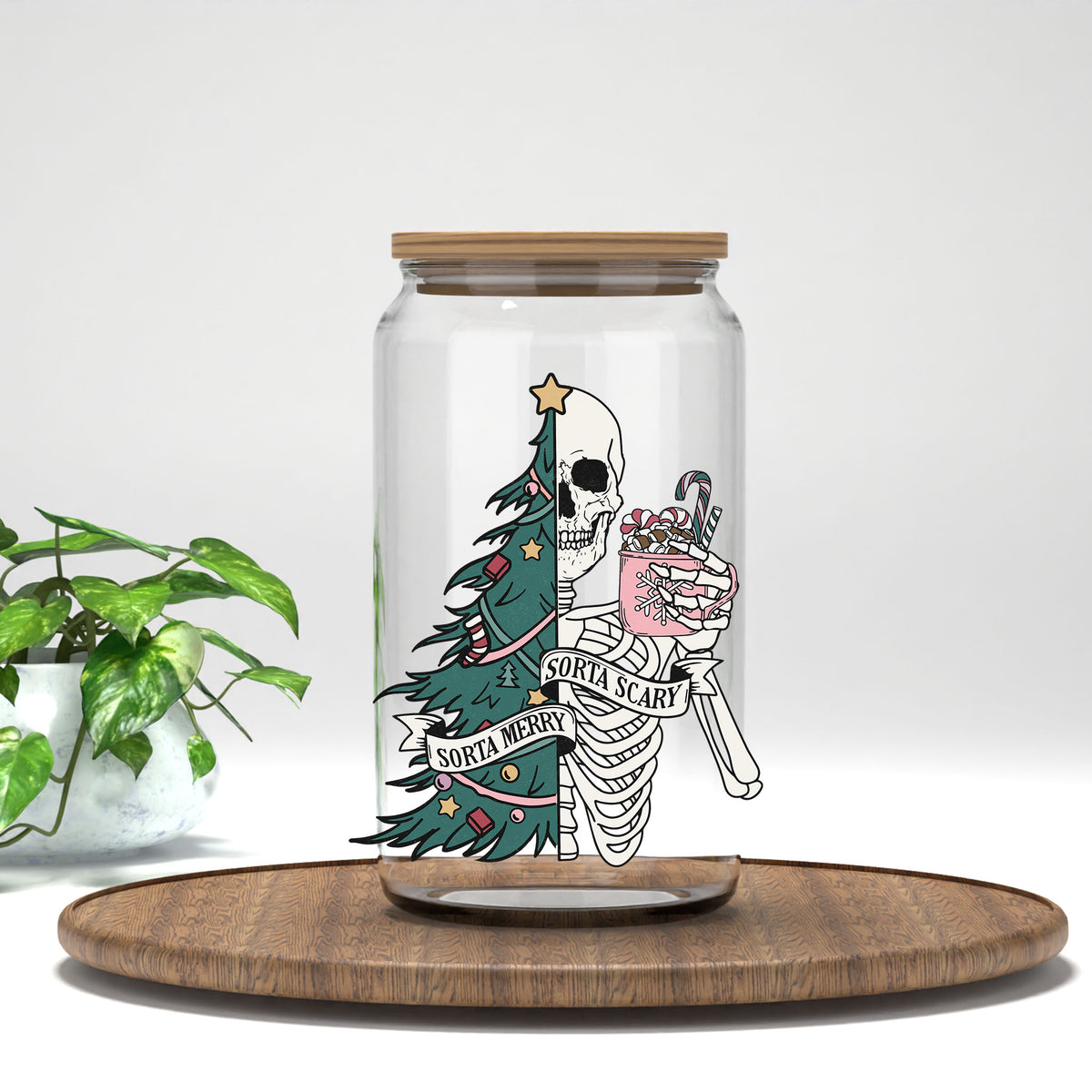 Sorta Merry Sorta Scary green tree skeleton UV DTF transfer on a clear glass can
