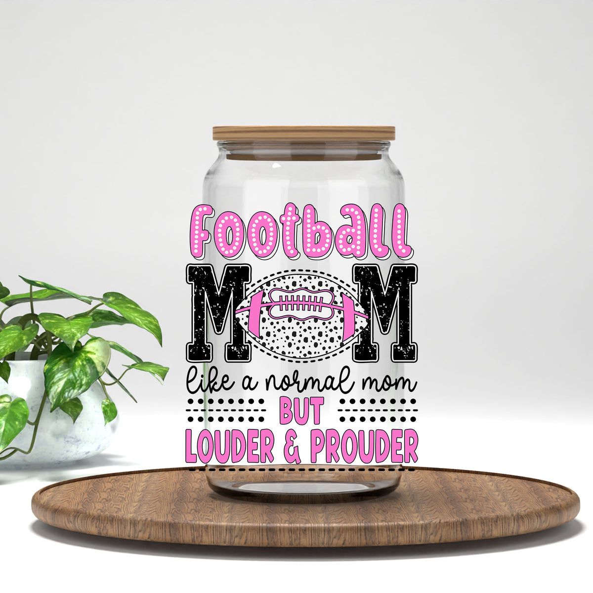 Football Mom louder and prouder UV DTF transfer on a clear glass can