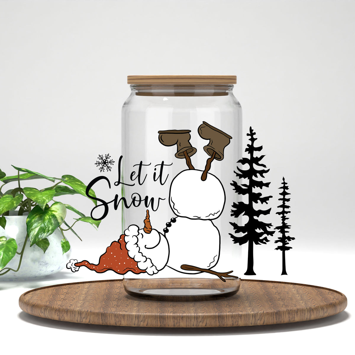 Let It Snow upside-down snowman UV DTF transfer on a clear glass can