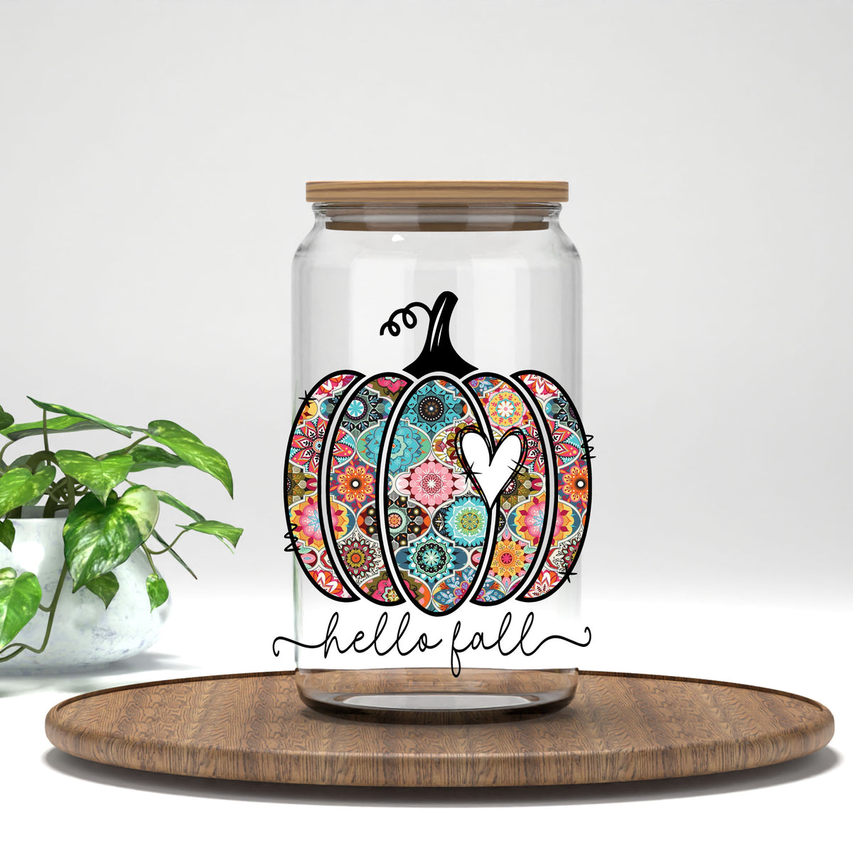 Hello Fall patchwork floral pumpkin UV DTF transfer on a clear glass can