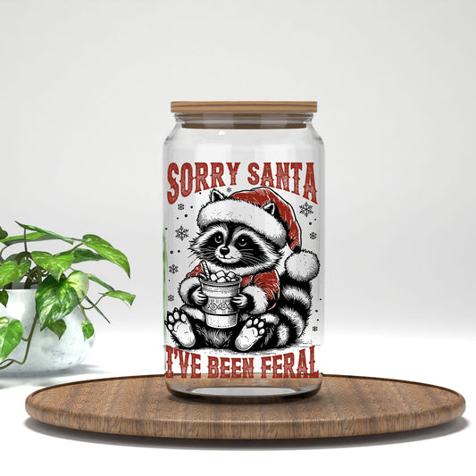 Sorry Santa I've Been Feral UV DTF transfer on a clear glass can