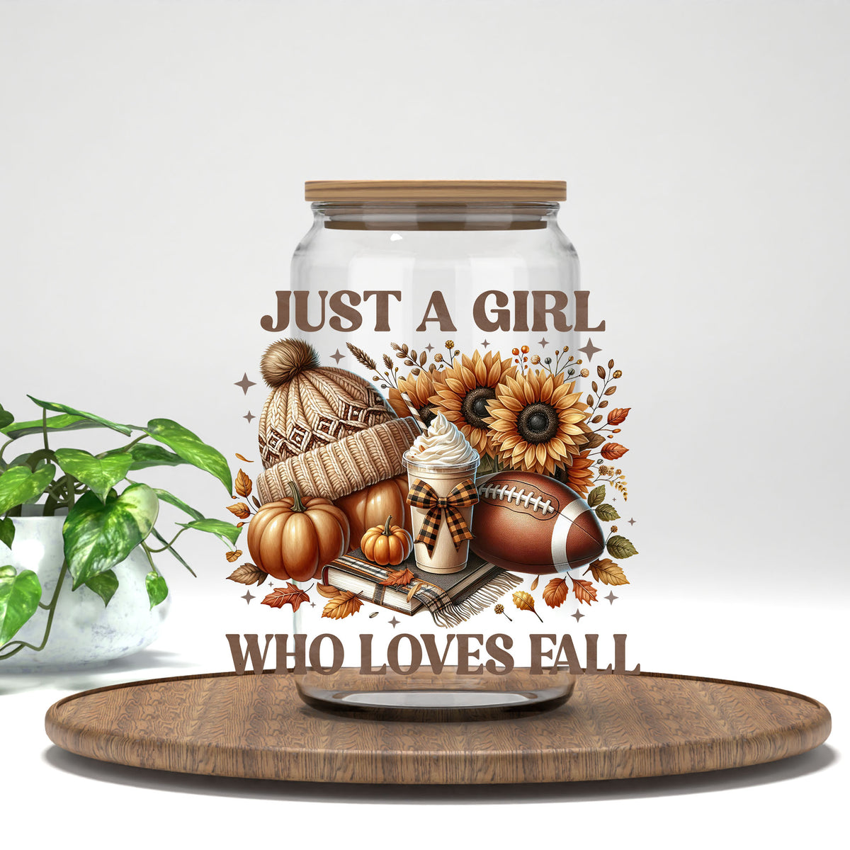 Just a Girl Who Loves Fall beanie, football, and sunflowers UV DTF transfer on a clear glass can