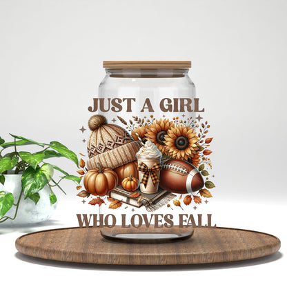 Just a Girl Who Loves Fall beanie, football, and sunflowers UV DTF transfer on a clear glass can