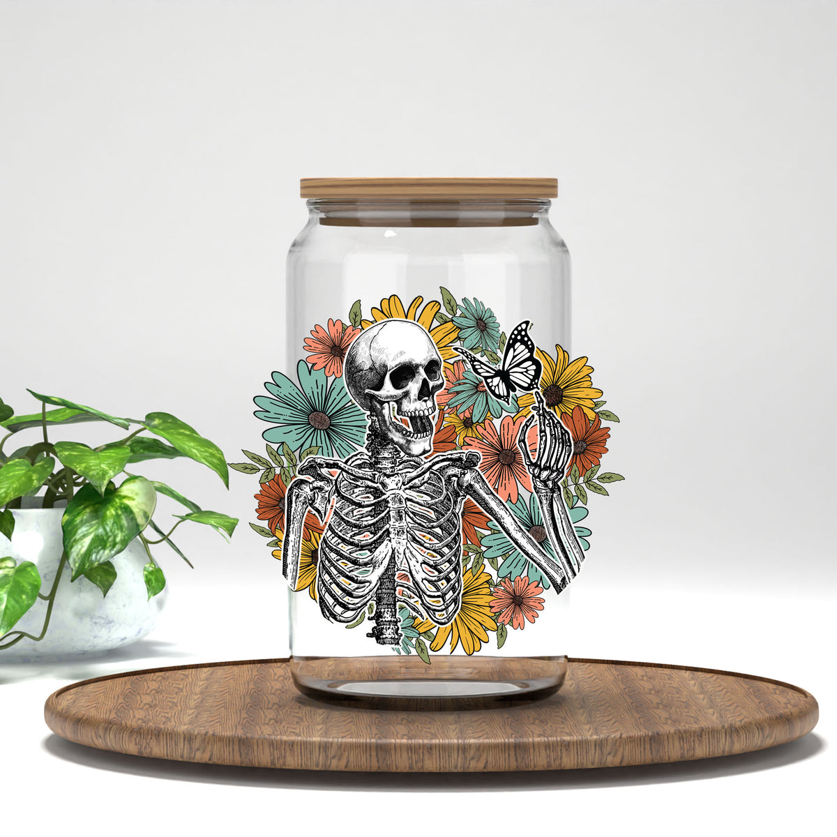 Retro Floral Skeleton UV DTF transfer on a clear glass can