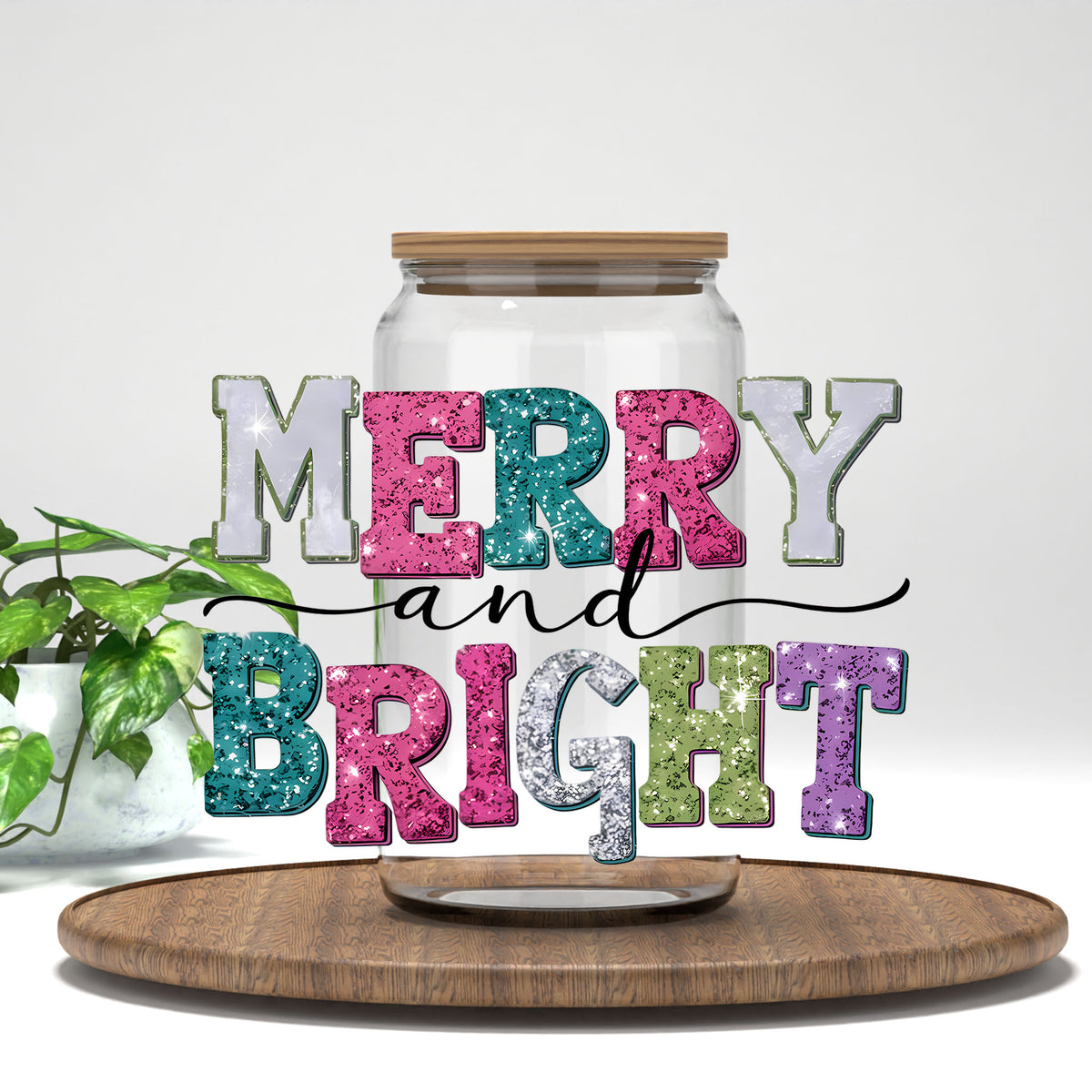 Merry and Bright glitter letters UV DTF transfer on a clear glass can