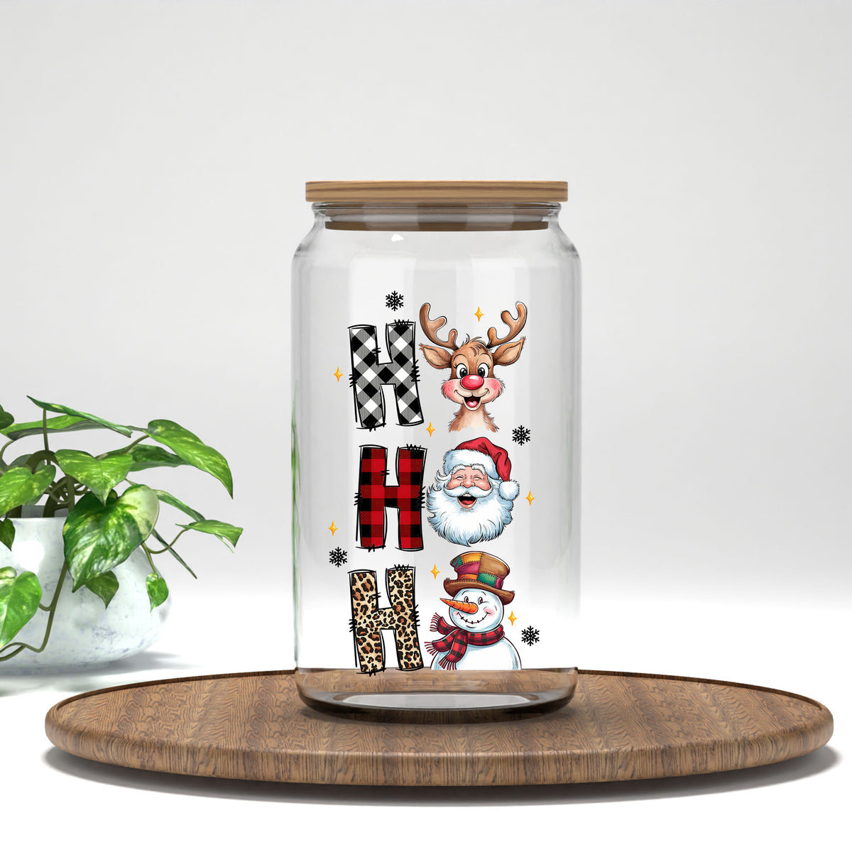 Ho Ho Ho Santa Reindeer Snowman UV DTF transfer on a clear glass can
