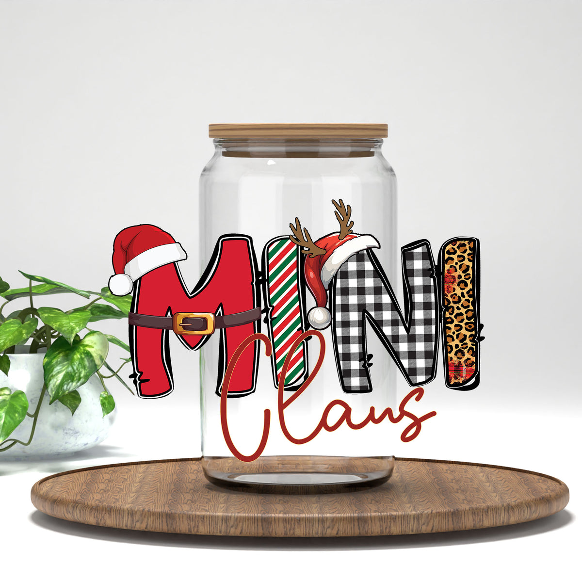 Mini Claus UV DTF transfer on a clear glass can
