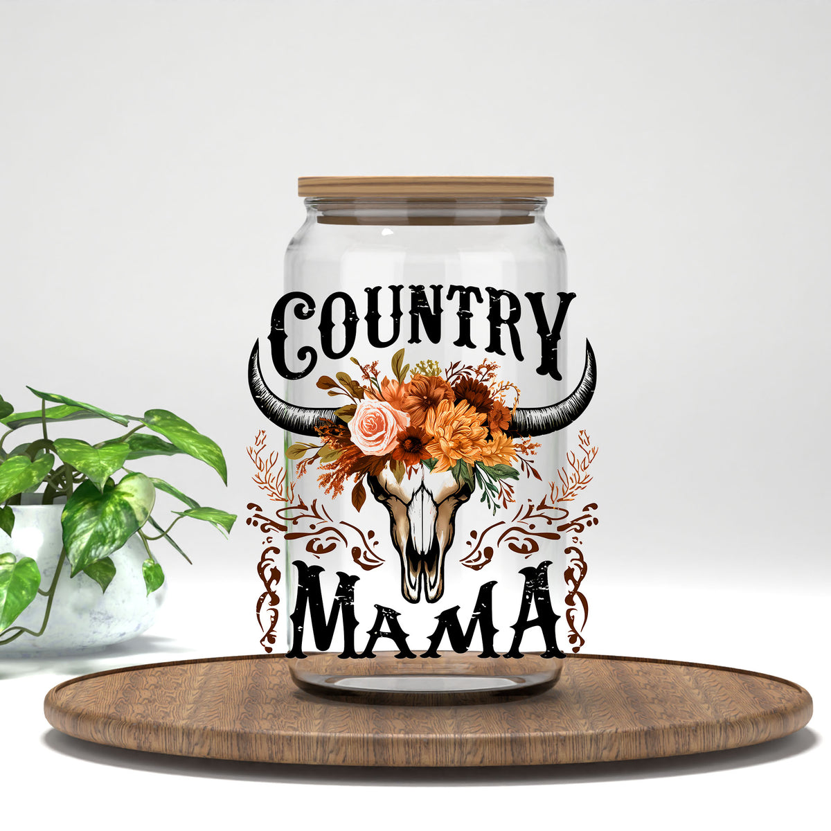Country Mama bull skull and flowers UV DTF transfer on a clear glass can
