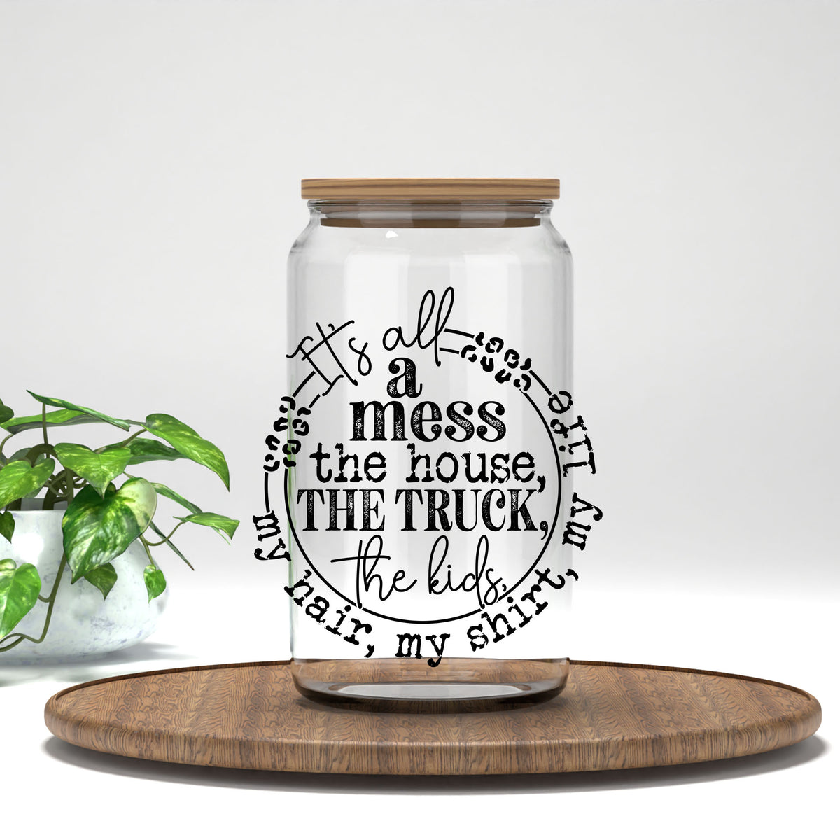 It's All a Mess circle text UV DTF transfer on a clear glass can