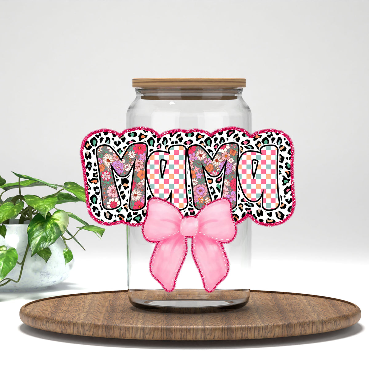 Mama leopard letters and pink bow UV DTF transfer on a clear glass can