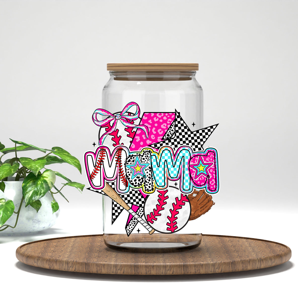 Baseball Mama pink bow and baseballs UV DTF transfer on a clear glass can