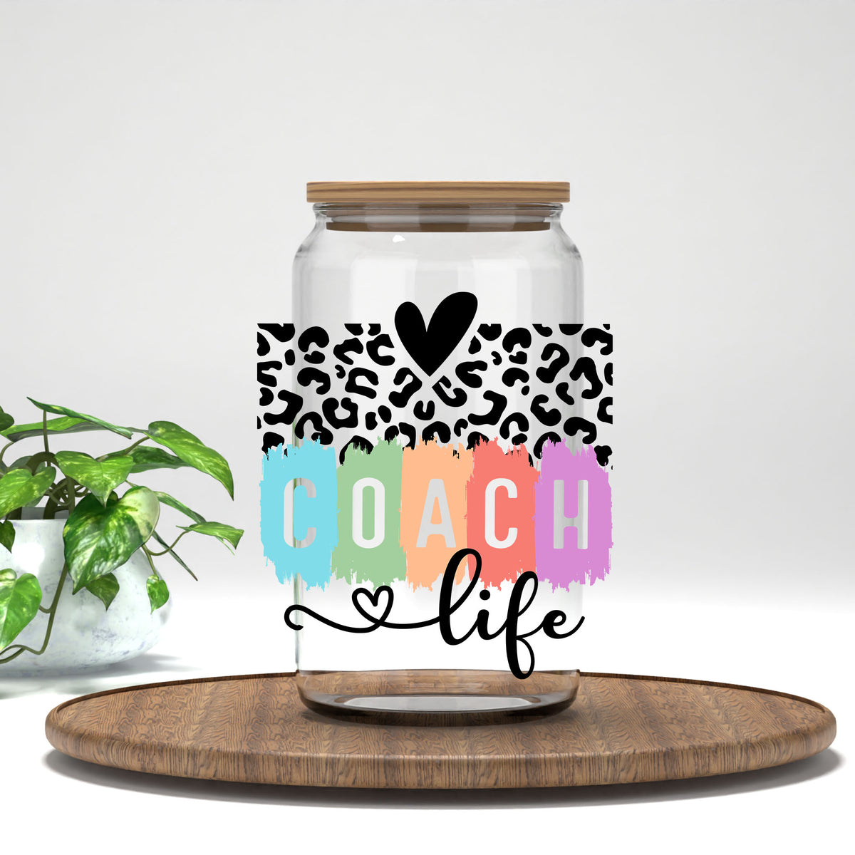 Coach Life UV DTF transfer on a clear glass can