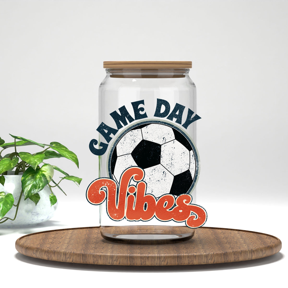 Game Day Vibes soccer ball UV DTF transfer on a clear glass can