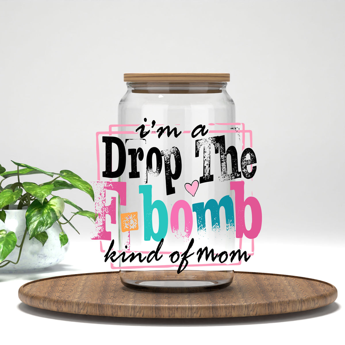 I'm a Drop the F-Bomb Kind of Mom UV DTF transfer on a clear glass can