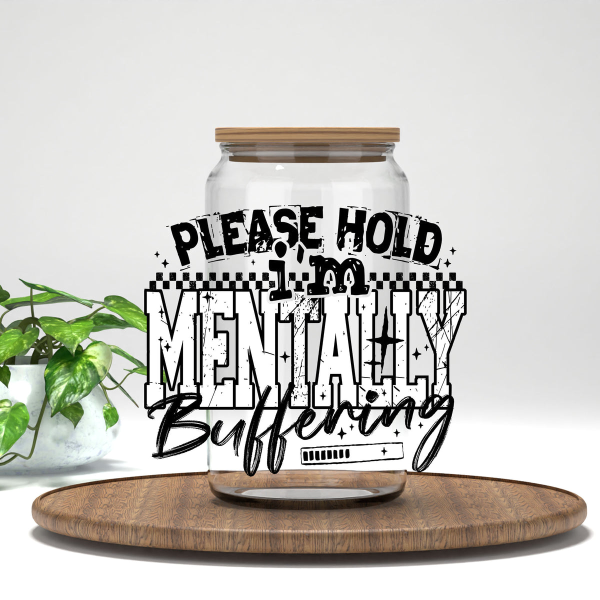 Please Hold I'm Mentally Buffering black letters UV DTF transfer on a clear glass can
