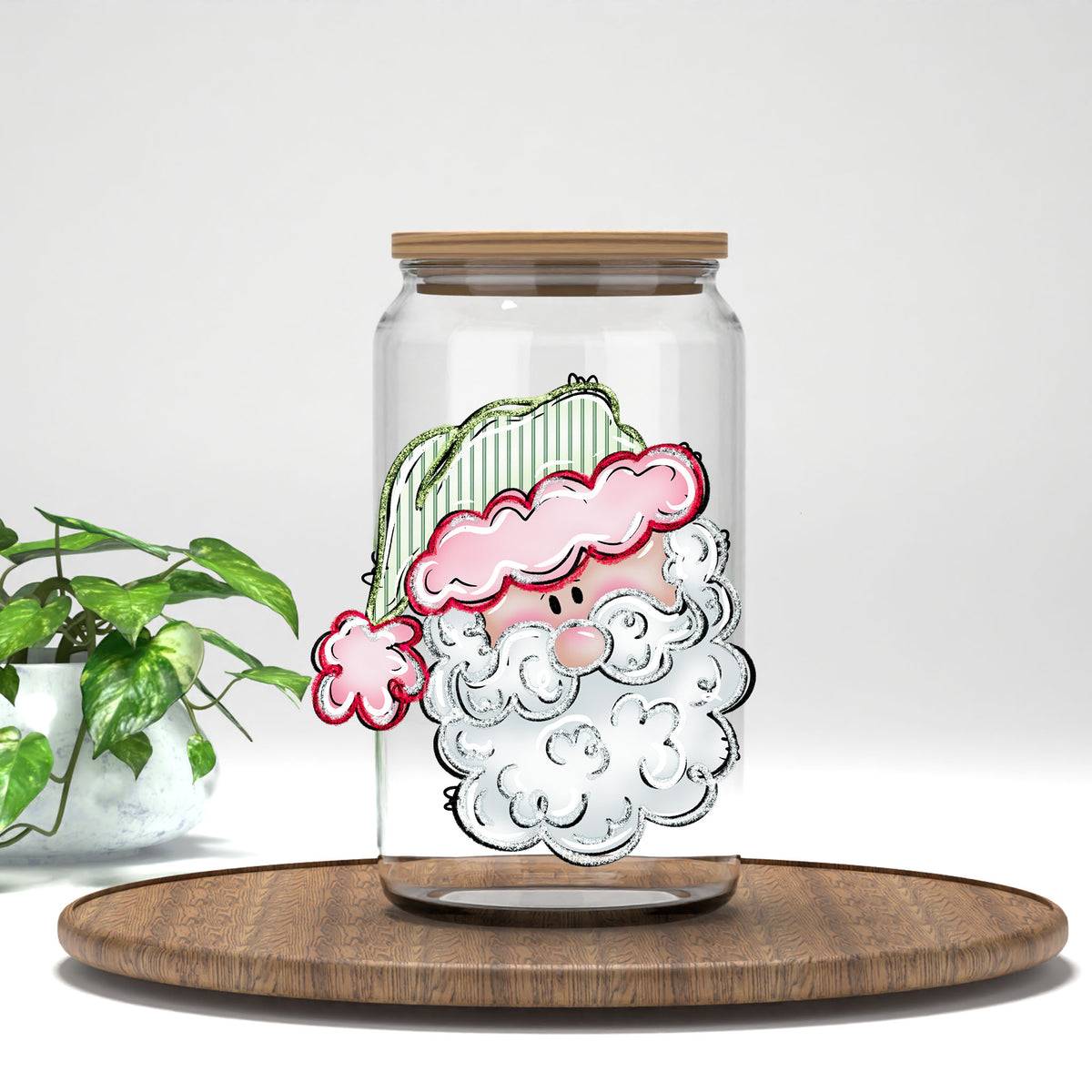 Pink Santa Face UV DTF transfer on a clear glass can