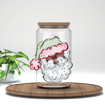 Pink and Green Santa Face UV DTF transfer on a clear glass can