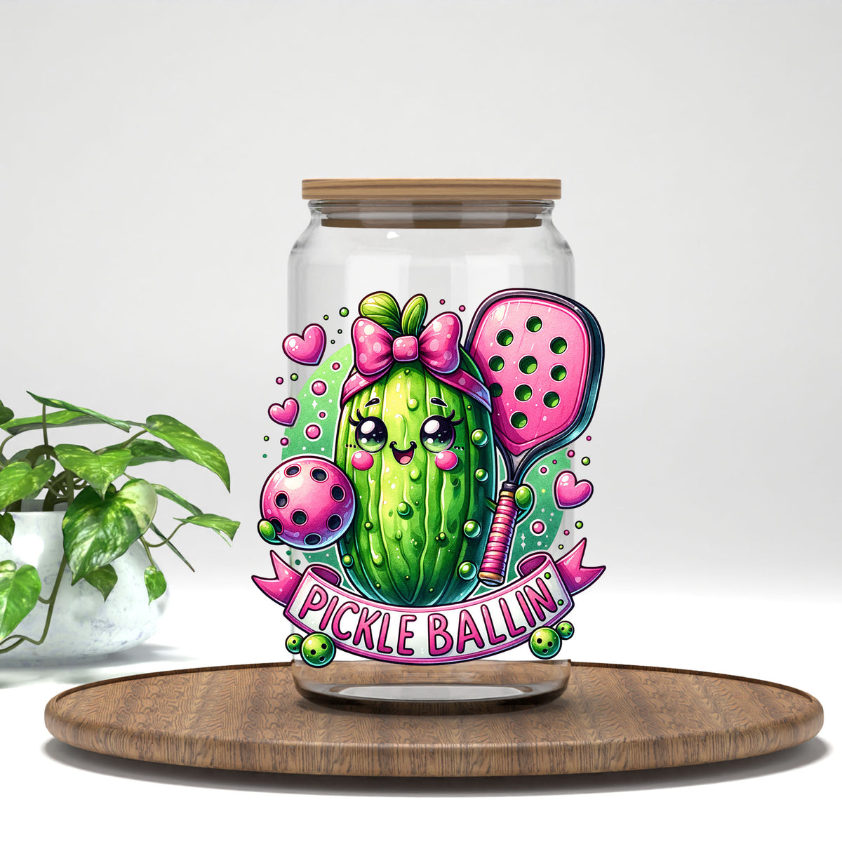 Pickle Ballin pickle with a pink bow UV DTF transfer on a clear glass can